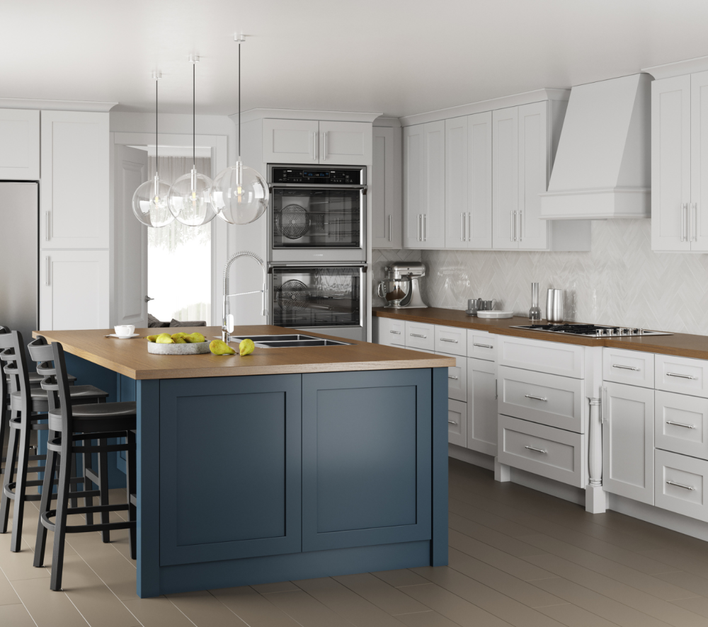 Modern kitchen design featuring white shaker cabinets, a large navy blue island with a wood countertop, stainless steel appliances, and pendant lights.