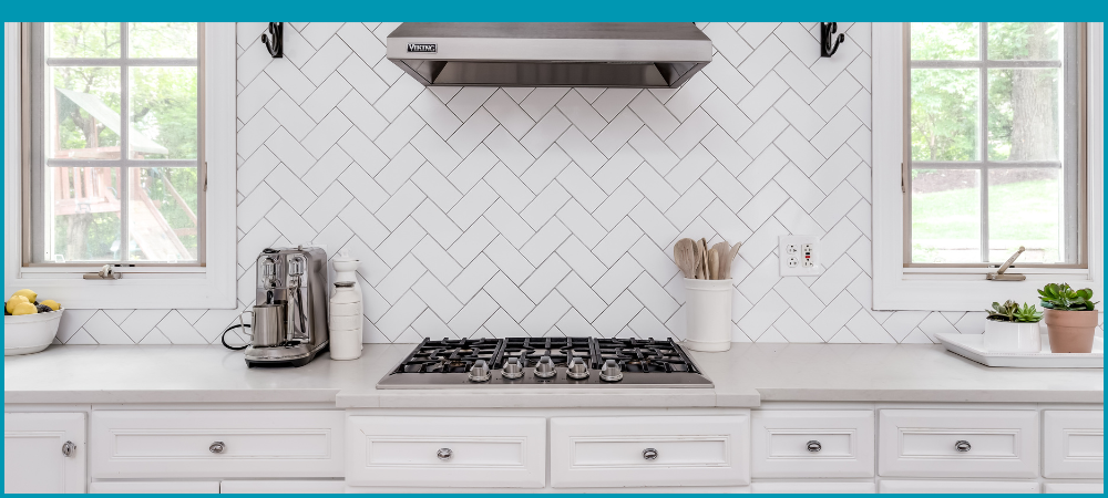 White herringbone tile backsplash